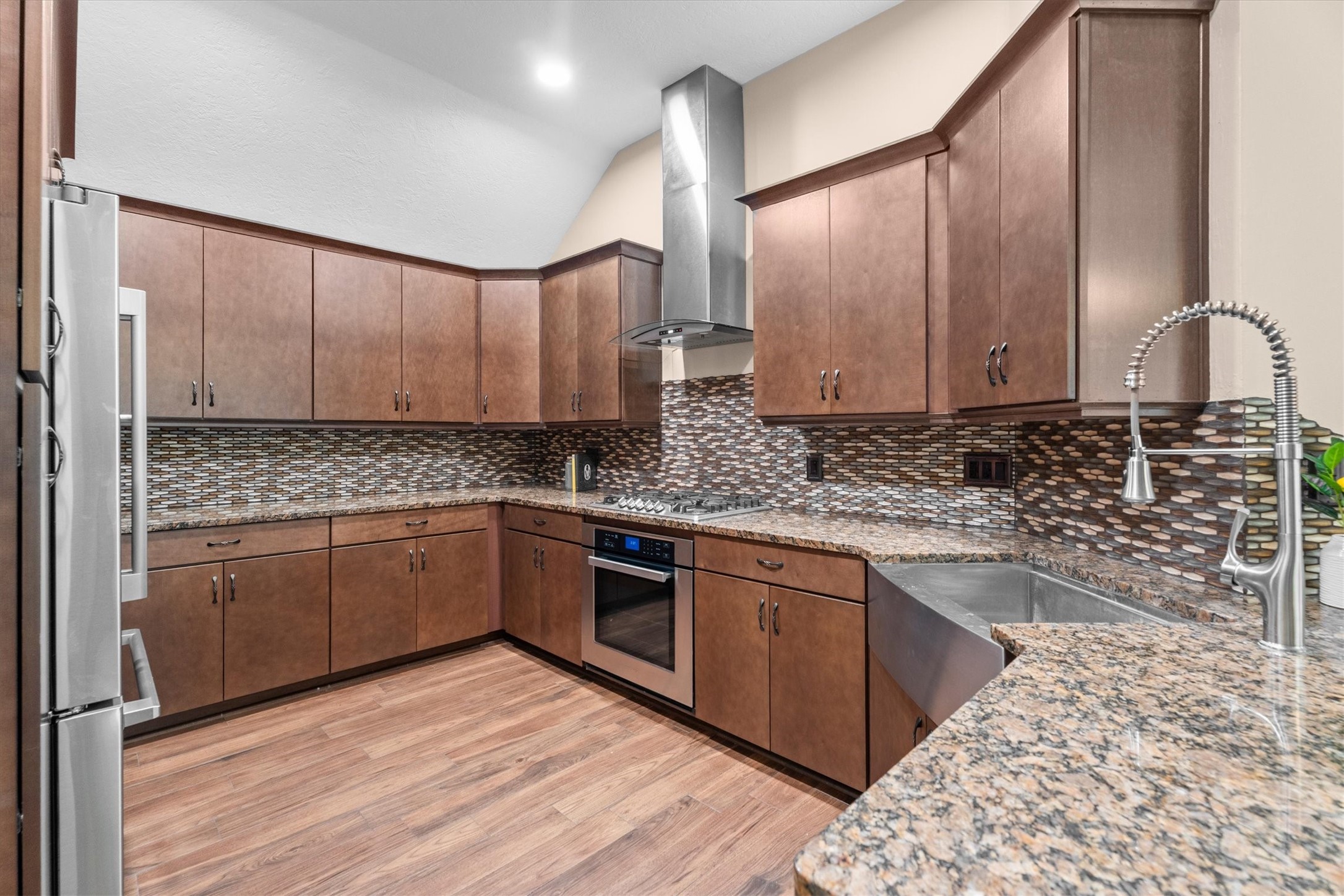 5010 Deer Point Drive Spring, TX 77389 - Photo 3 of 32 DREAM Kitchen featuring a vented hood, 5 burner gas range, chef sink, and more