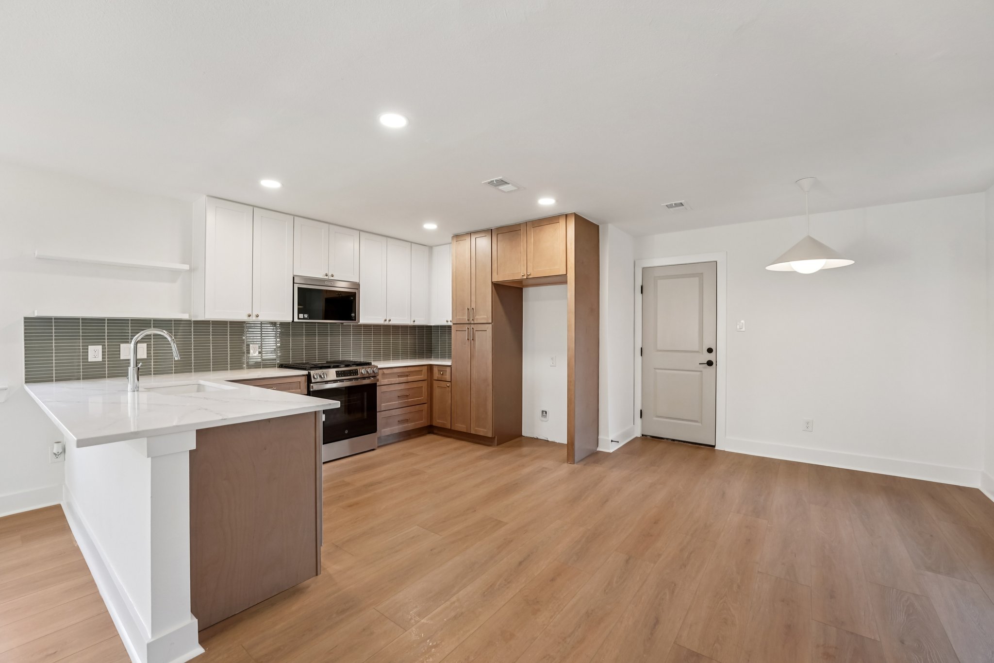 4901 Transit Circle Austin, TX 78727 - Photo 11 of 29 a kitchen with stainless steel appliances a sink and a refrigerator