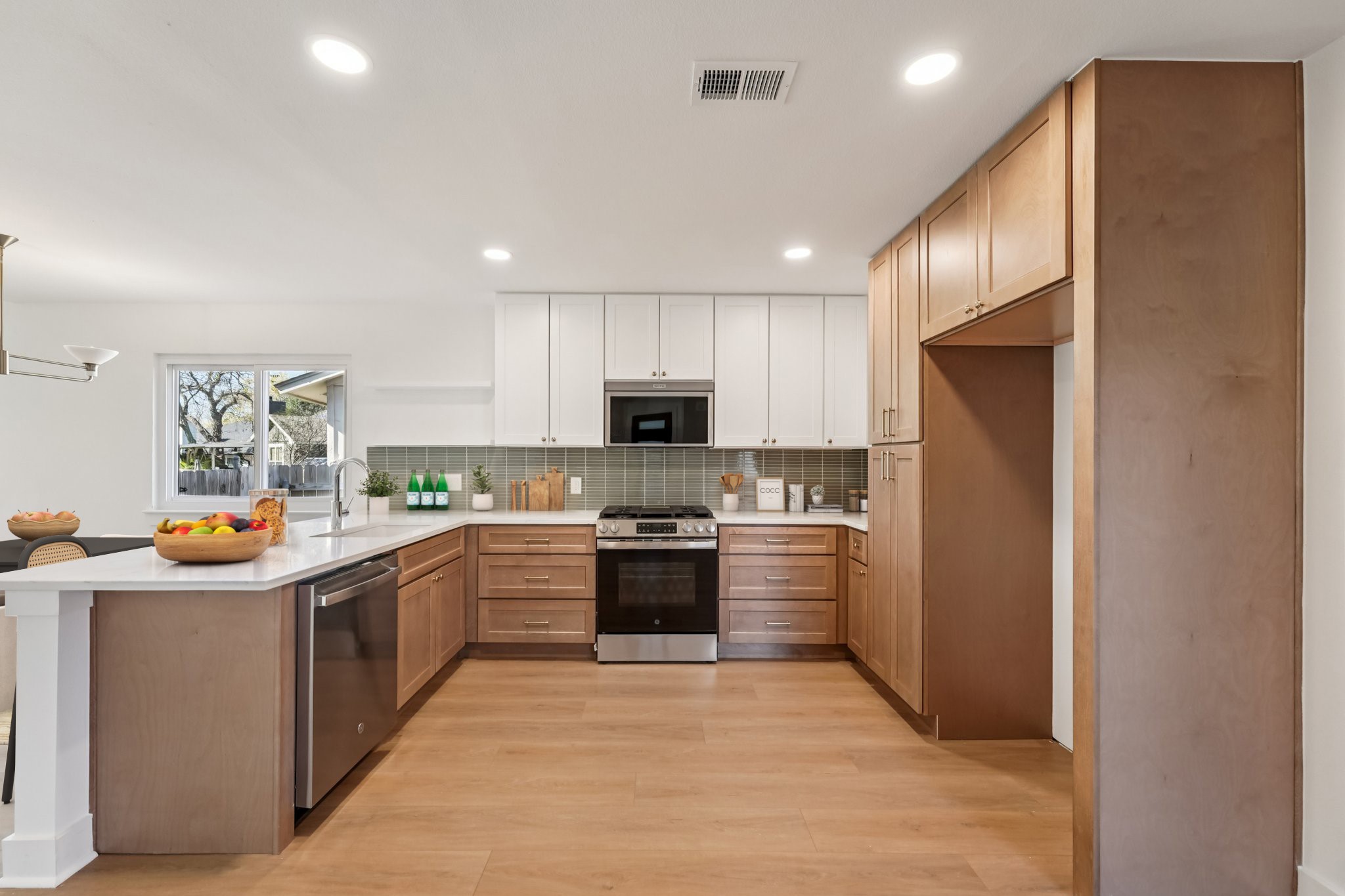 4901 Transit Circle Austin, TX 78727 - Photo 2 of 29 a kitchen with stainless steel appliances granite countertop a refrigerator and a stove top oven