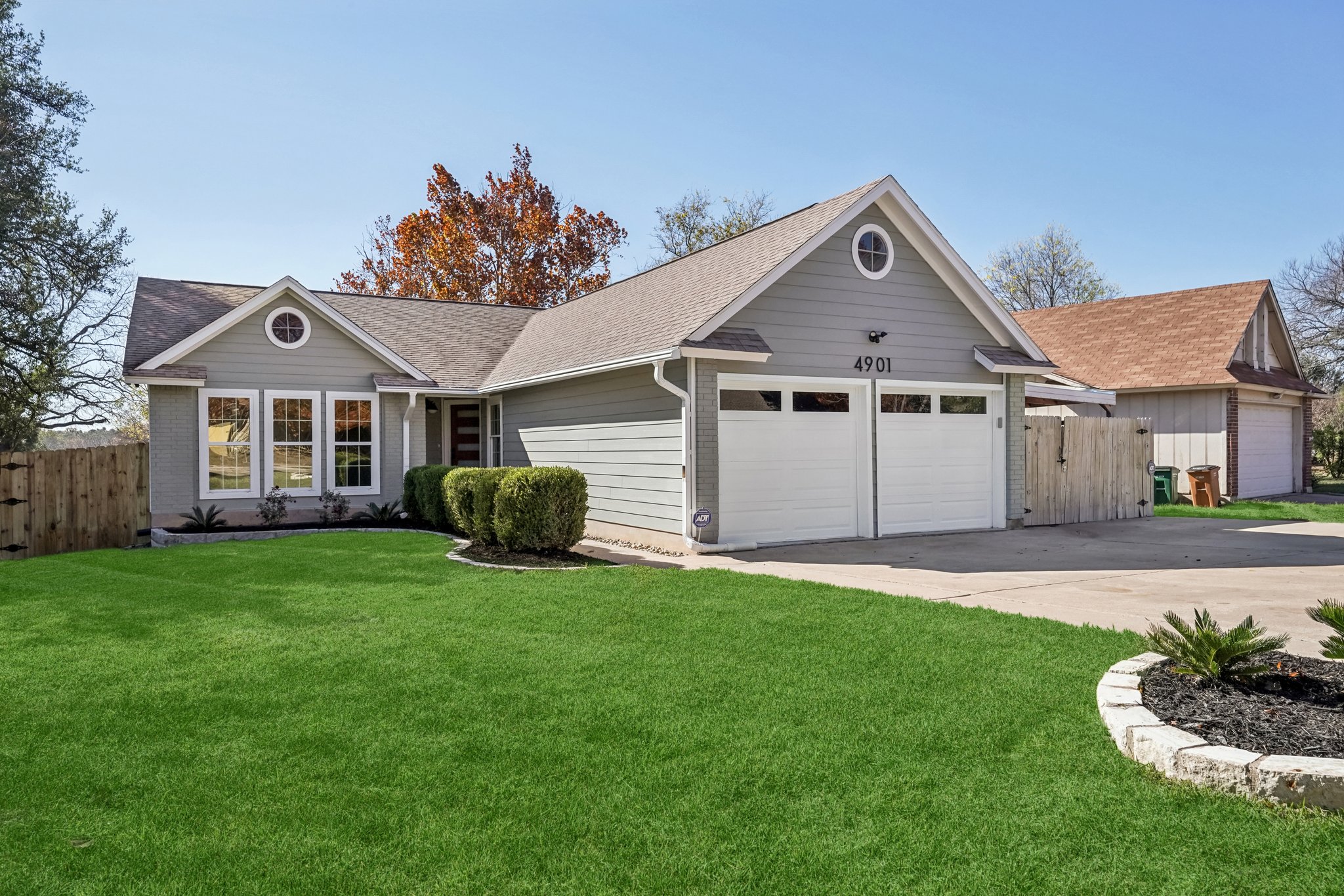 4901 Transit Circle Austin, TX 78727 - Photo 26 of 29 a front view of a house with a garden and yard
