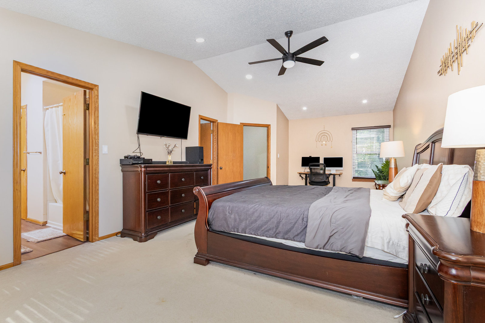 1201 Oak Ridge Drive Streamwood, IL 60107 - Photo 16 of 36 a spacious bedroom with a bed and a flat screen tv