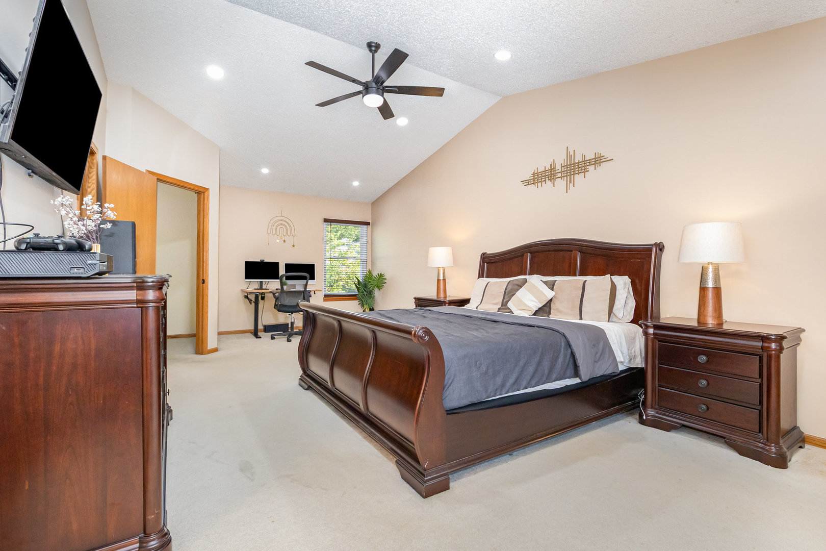 1201 Oak Ridge Drive Streamwood, IL 60107 - Photo 17 of 36 a bedroom with a bed and a flat screen tv