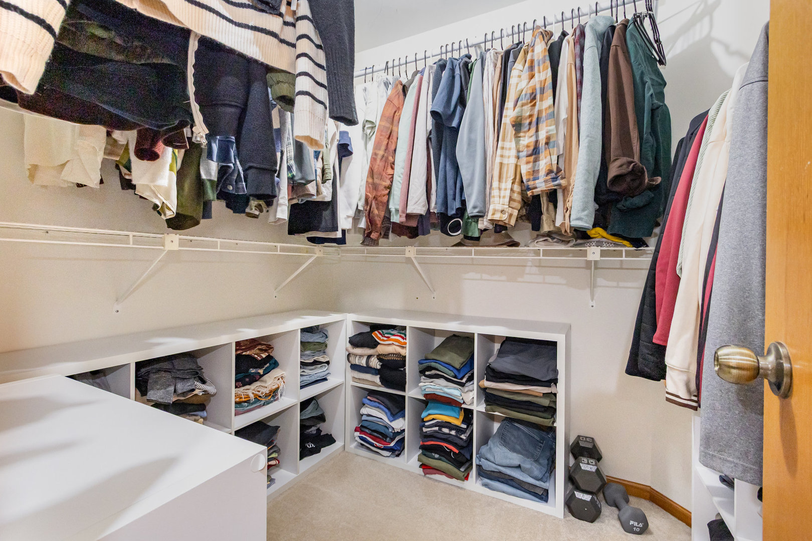 1201 Oak Ridge Drive Streamwood, IL 60107 - Photo 18 of 36 a view of walk in closet with clothes and shoes