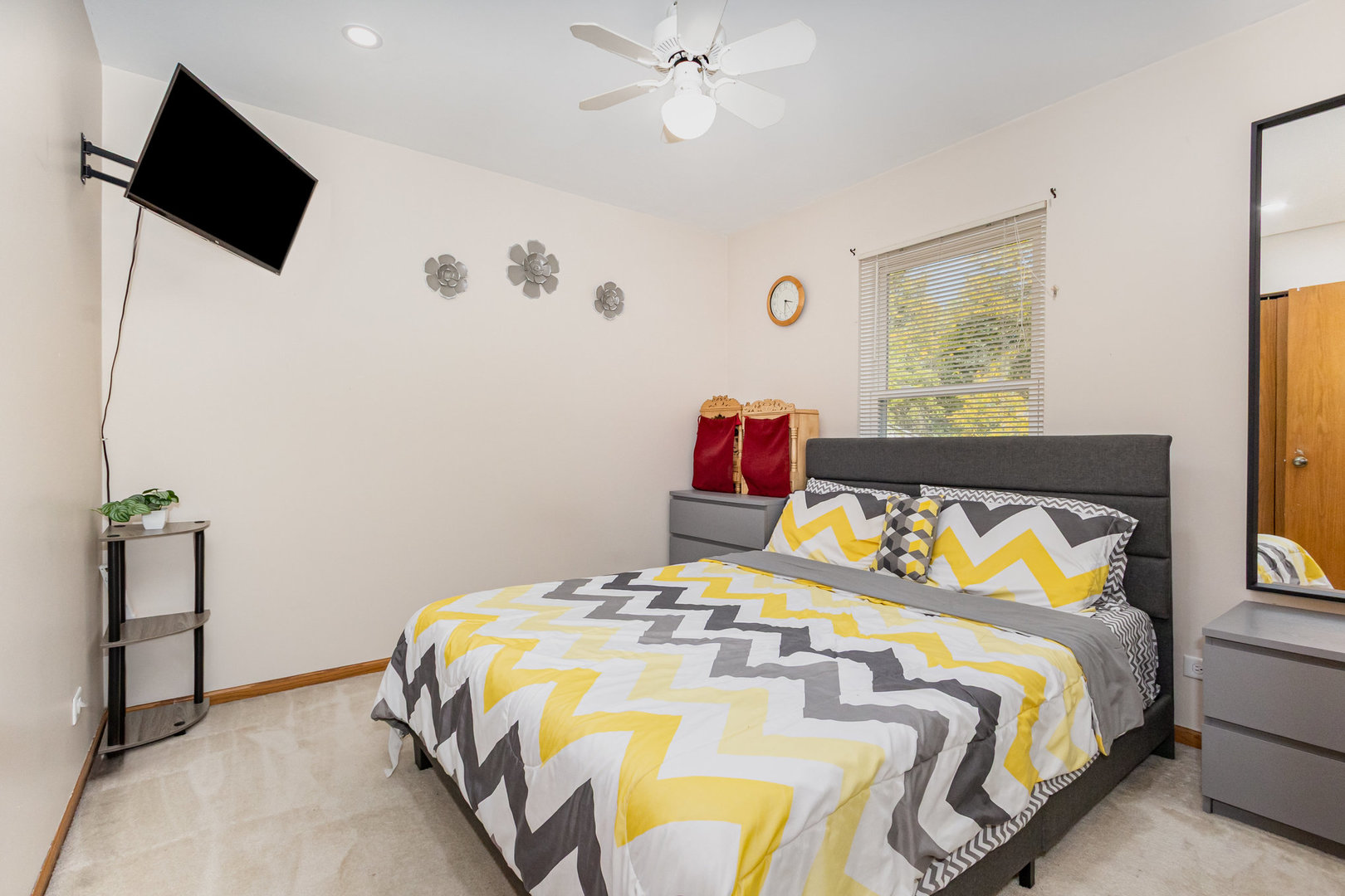 1201 Oak Ridge Drive Streamwood, IL 60107 - Photo 21 of 36 a bedroom with a bed and a flat screen tv