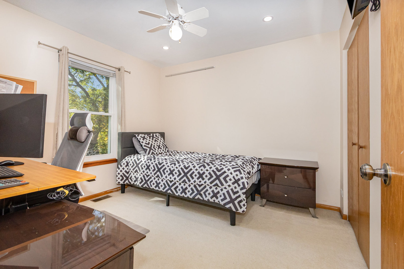 1201 Oak Ridge Drive Streamwood, IL 60107 - Photo 22 of 36 a bedroom with a bed and a window
