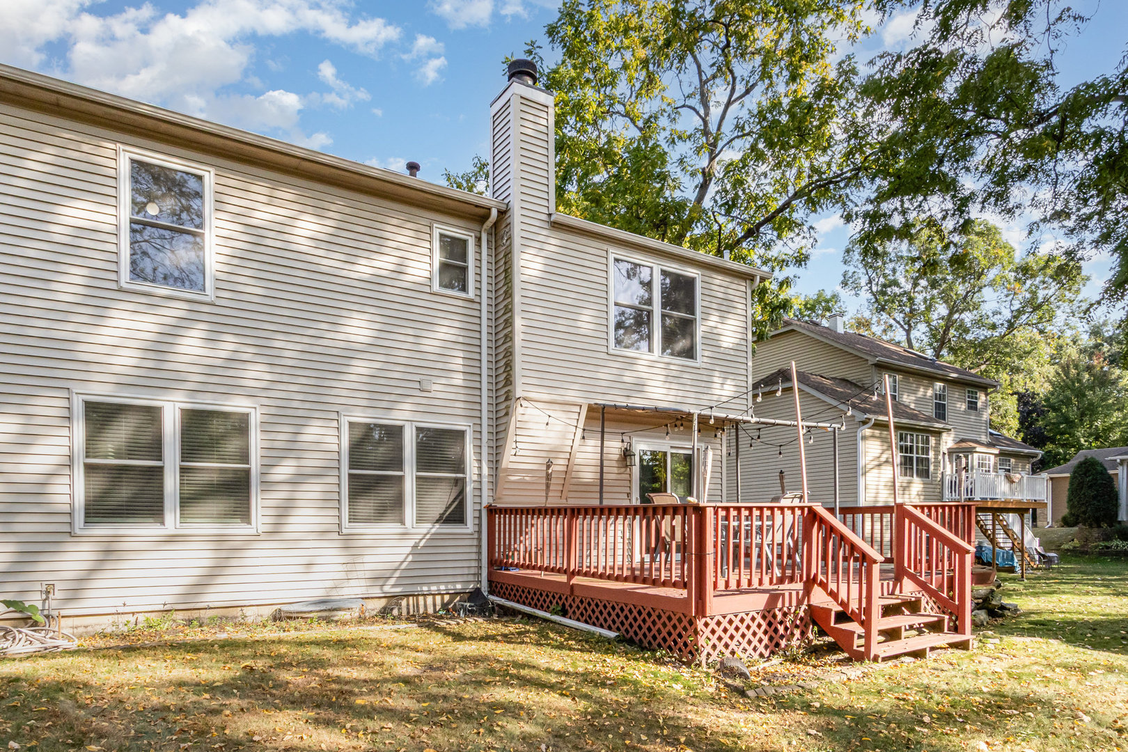 1201 Oak Ridge Drive Streamwood, IL 60107 - Photo 29 of 36 a view of a house with a small yard and swimming pool