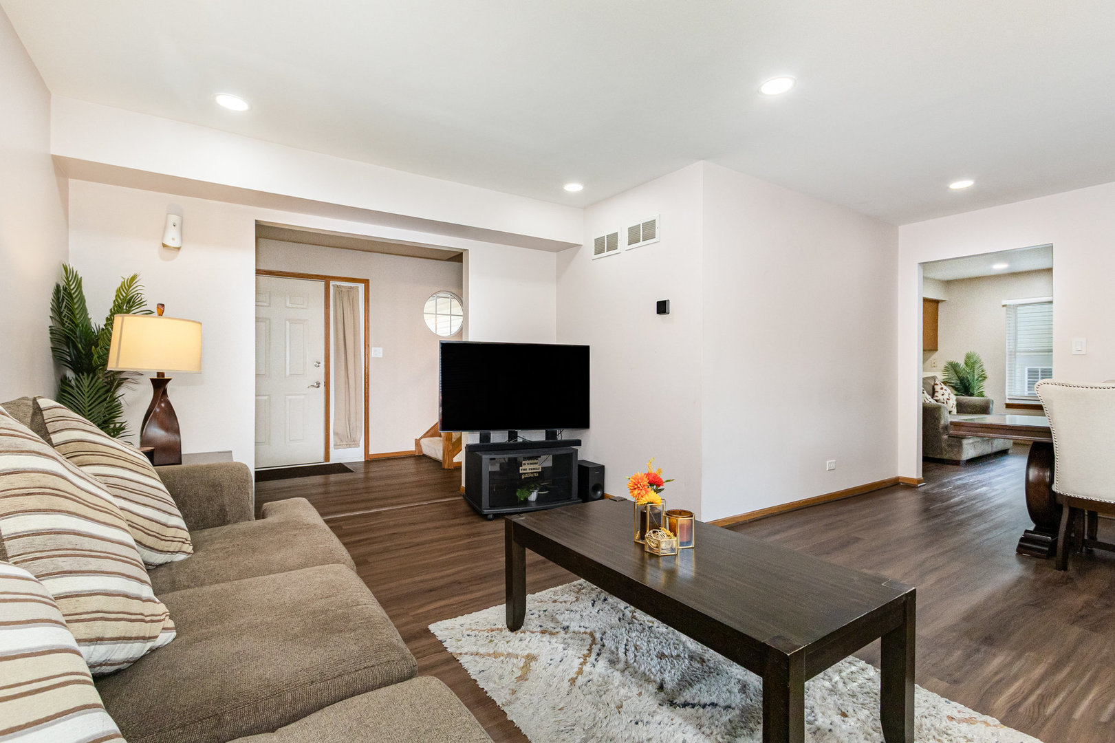 1201 Oak Ridge Drive Streamwood, IL 60107 - Photo 5 of 36 a living room with furniture and a flat screen tv