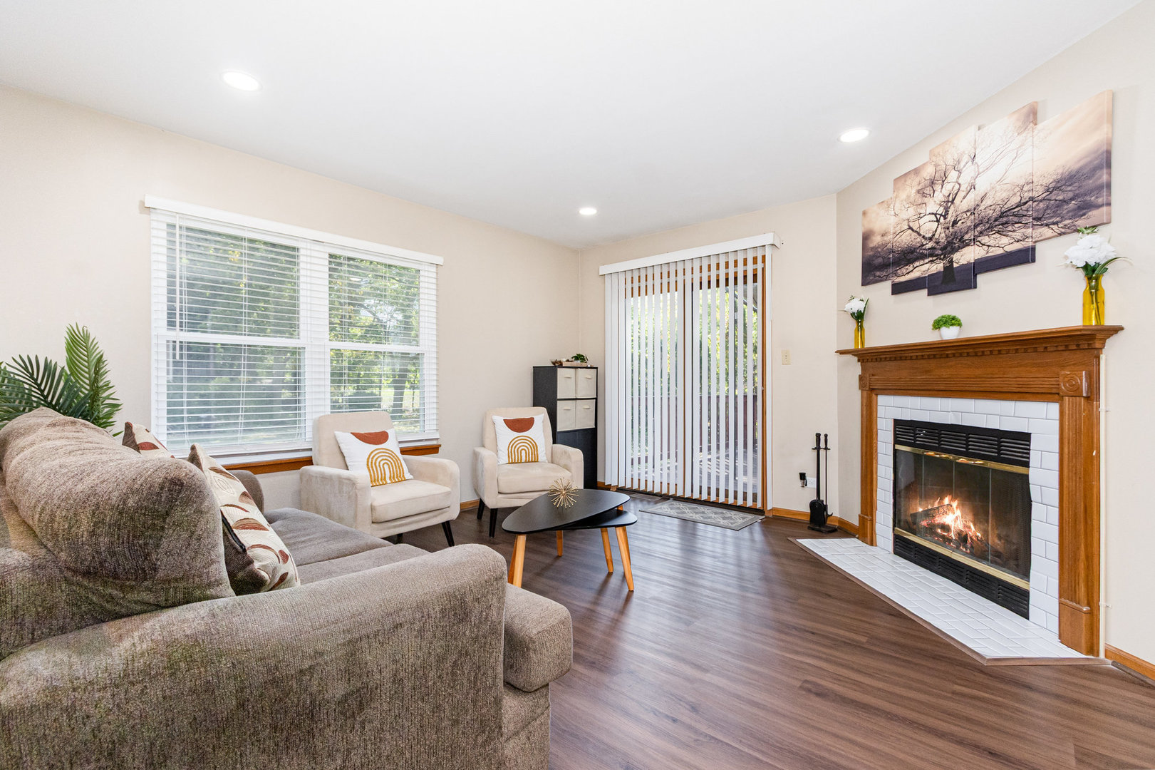 1201 Oak Ridge Drive Streamwood, IL 60107 - Photo 8 of 36 a living room with furniture large window and a fireplace