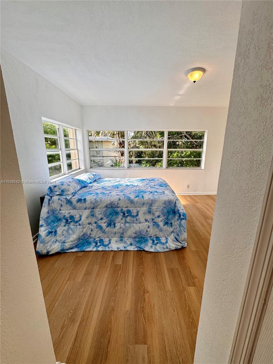 934 79th Terrace, Unit 2 Miami Beach, FL 33141 - Photo 12 of 42 a view of kitchen and wooden floor