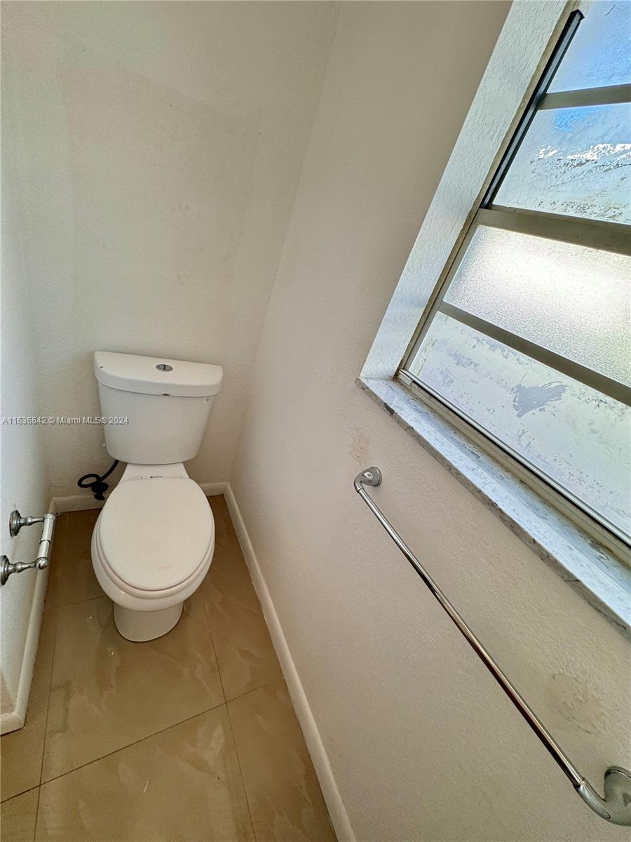 934 79th Terrace, Unit 2 Miami Beach, FL 33141 - Photo 16 of 42 a bathroom with a toilet