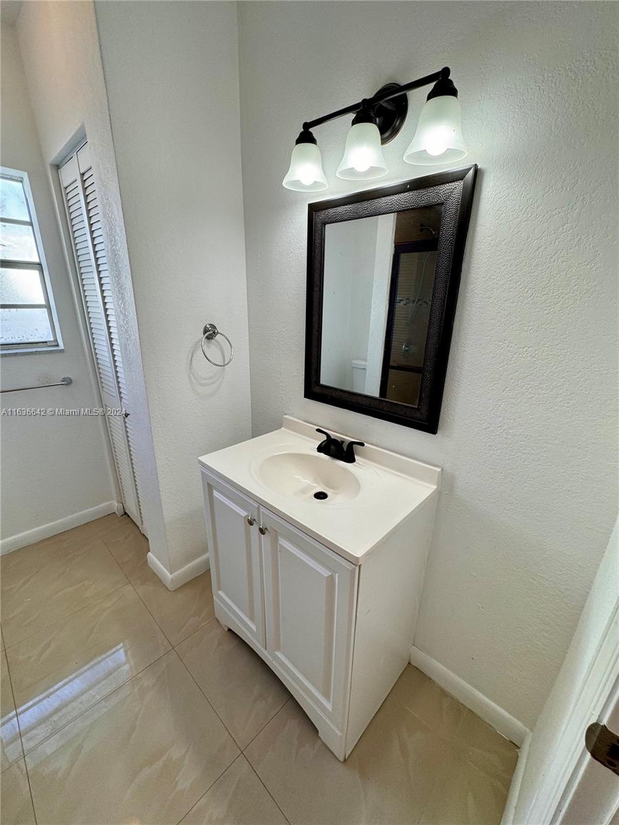 934 79th Terrace, Unit 2 Miami Beach, FL 33141 - Photo 17 of 42 a utility room with a sink washer and dryer