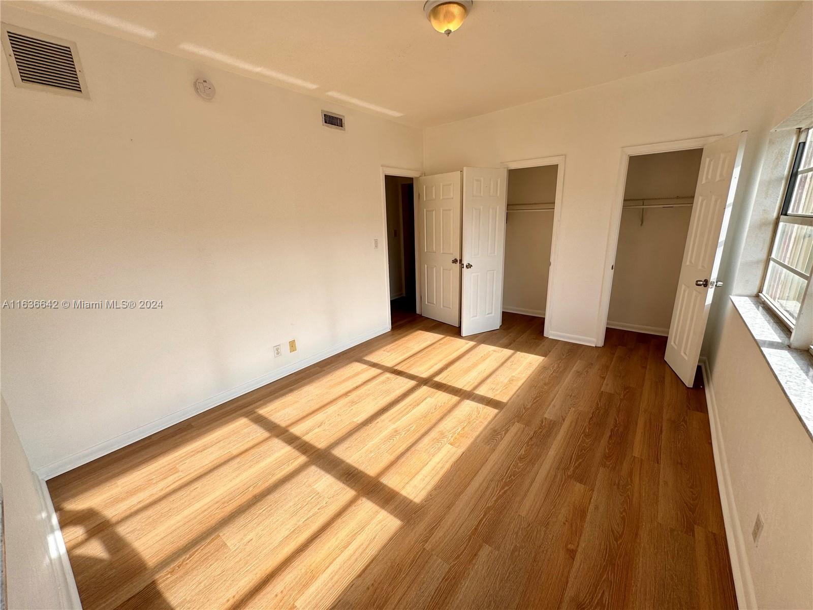 934 79th Terrace, Unit 2 Miami Beach, FL 33141 - Photo 19 of 42 a view of hallway with a large window