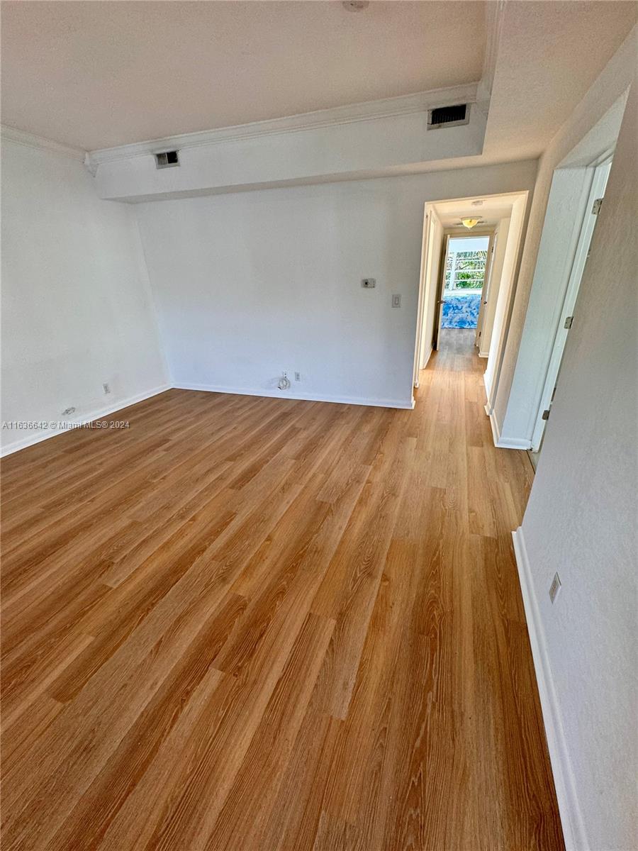 934 79th Terrace, Unit 2 Miami Beach, FL 33141 - Photo 25 of 42 wooden floor in an empty room
