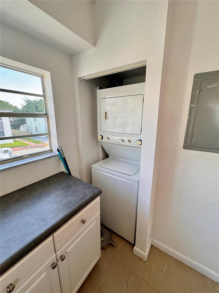 934 79th Terrace, Unit 2 Miami Beach, FL 33141 - Photo 30 of 42 a utility room with dryer and washer