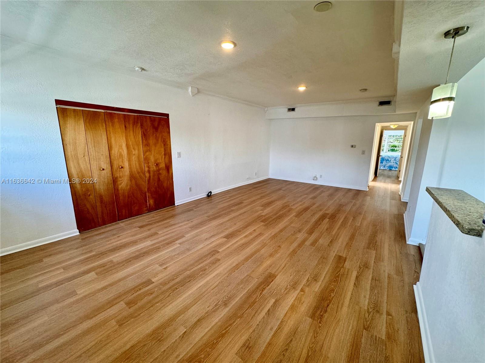934 79th Terrace, Unit 2 Miami Beach, FL 33141 - Photo 33 of 42 a view of a room with a wooden door