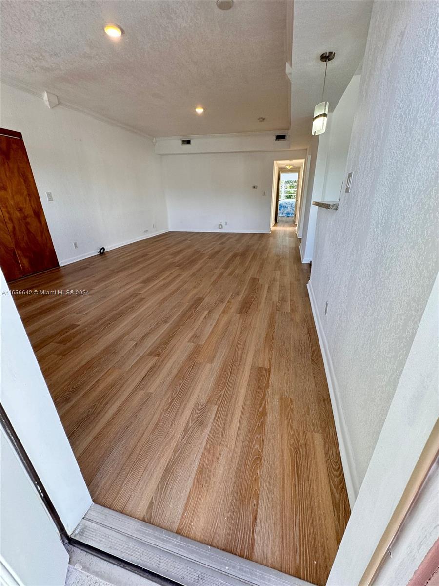 934 79th Terrace, Unit 2 Miami Beach, FL 33141 - Photo 34 of 42 a view of empty room with wooden floor