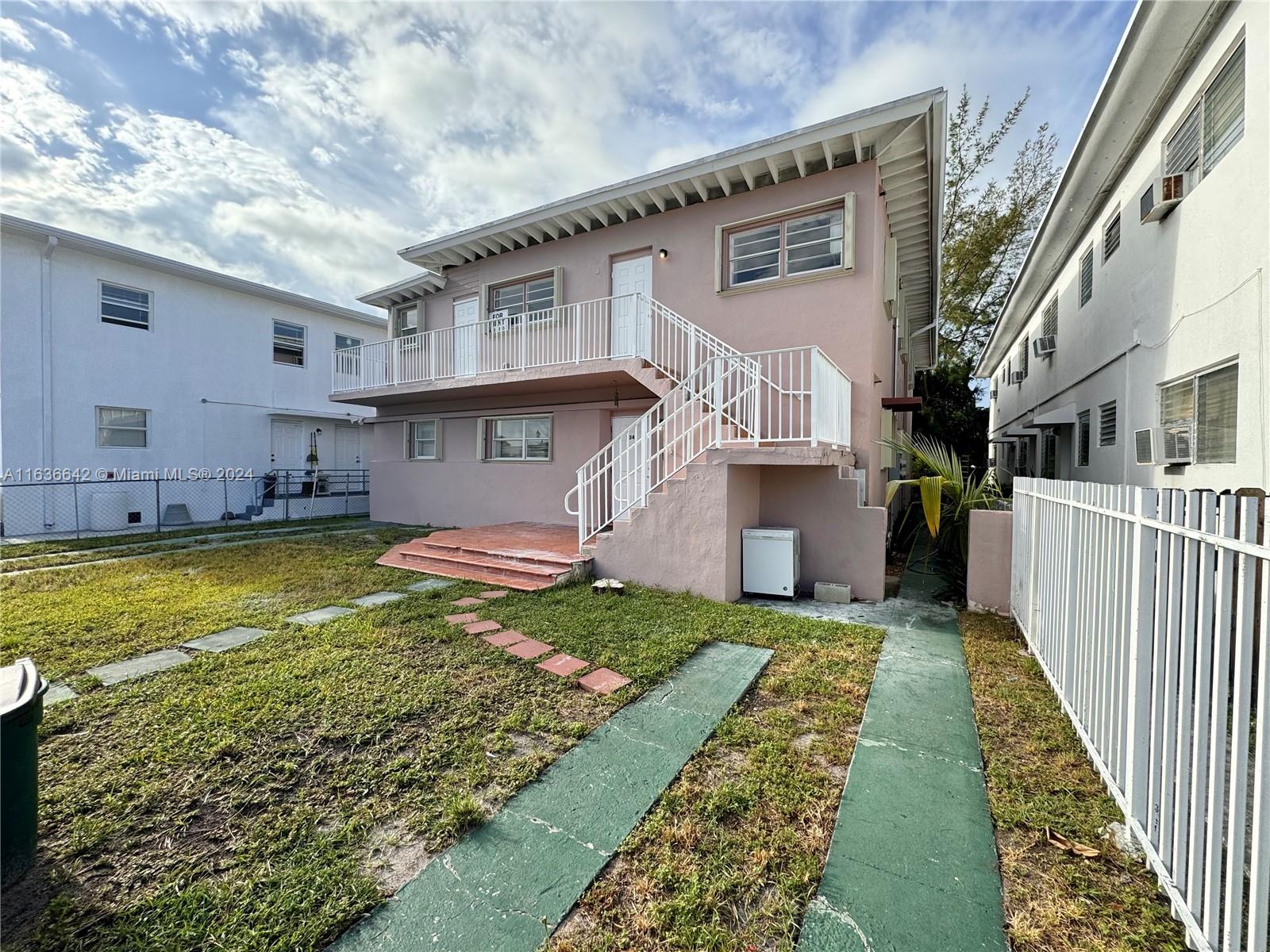 934 79th Terrace, Unit 2 Miami Beach, FL 33141 - Photo 37 of 42 a view of a house with a swimming pool