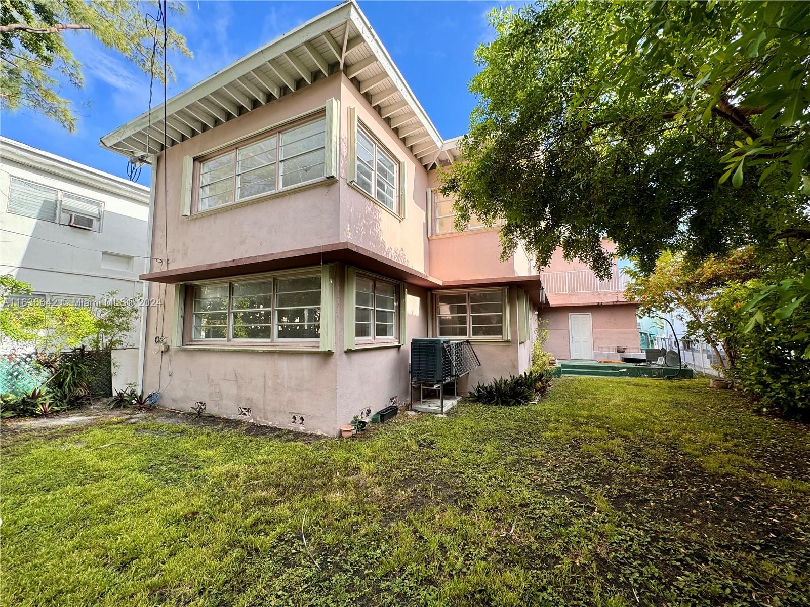 934 79th Terrace, Unit 2 Miami Beach, FL 33141 - Photo 42 of 42 a front view of a house with a yard