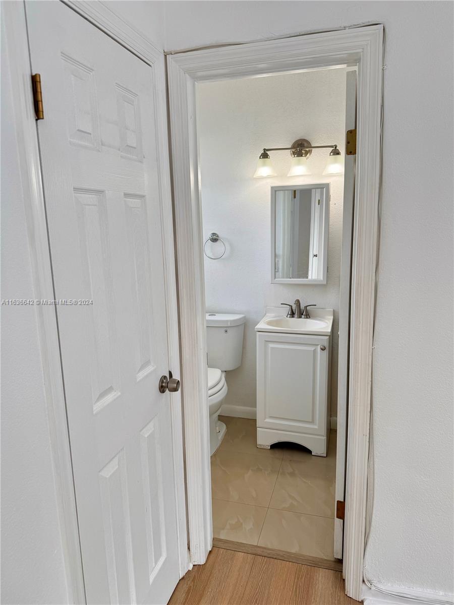 934 79th Terrace, Unit 2 Miami Beach, FL 33141 - Photo 9 of 42 a bathroom with a sink a toilet and shower
