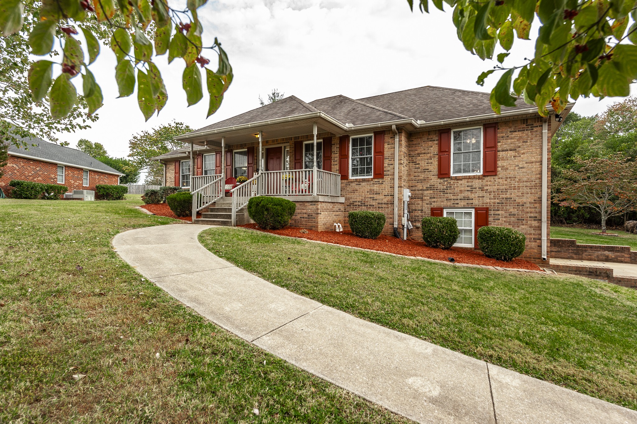 313 Lenox Court Springfield, TN 37172 - Photo 3 of 45 a front view of a house with a yard and potted plants