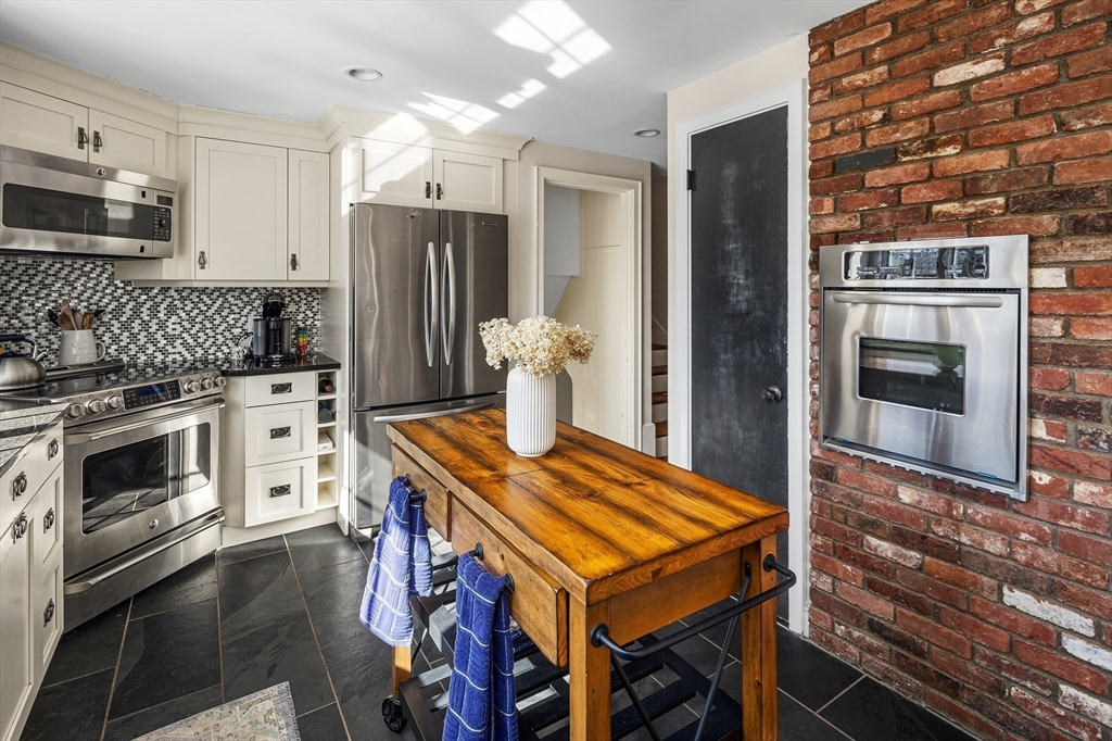 36 Howland Lane Hingham, MA 02043 - Photo 12 of 33 a kitchen with a stove a refrigerator and a stove top oven