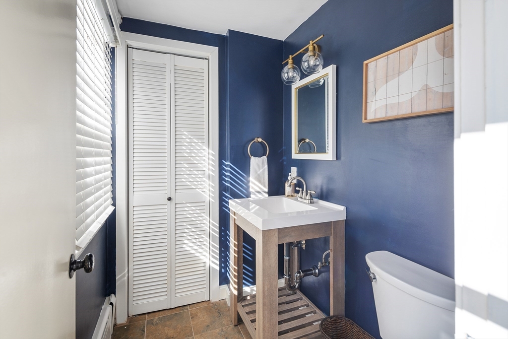 36 Howland Lane Hingham, MA 02043 - Photo 13 of 33 a bathroom with a toilet sink and mirror