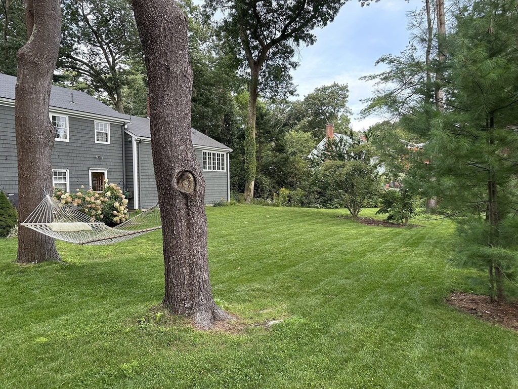 36 Howland Lane Hingham, MA 02043 - Photo 27 of 33 a front view of a house with garden