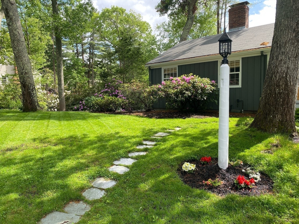 36 Howland Lane Hingham, MA 02043 - Photo 29 of 33 a view of a house with a yard and garden