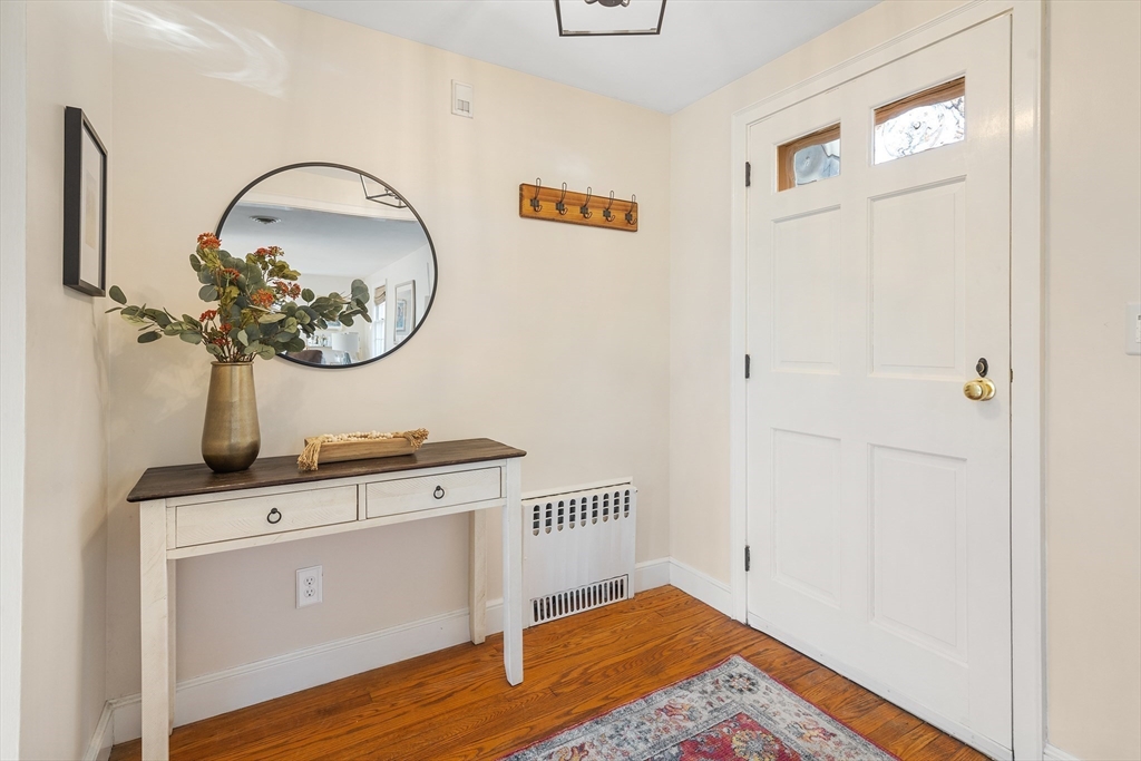 36 Howland Lane Hingham, MA 02043 - Photo 3 of 33 a view of a hallway with wooden floor
