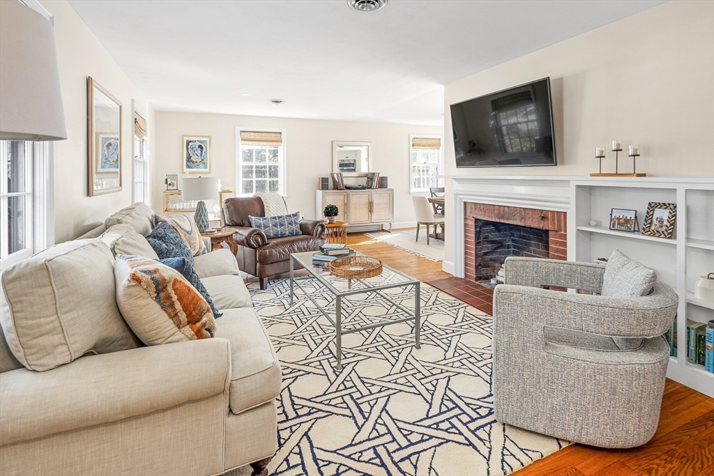 36 Howland Lane Hingham, MA 02043 - Photo 4 of 33 a living room with furniture a fireplace and flat screen tv