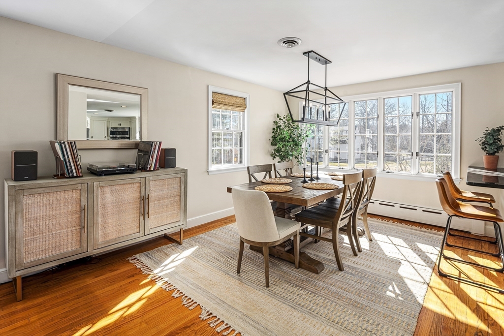36 Howland Lane Hingham, MA 02043 - Photo 5 of 33 a dining room with furniture a chandelier and wooden floor