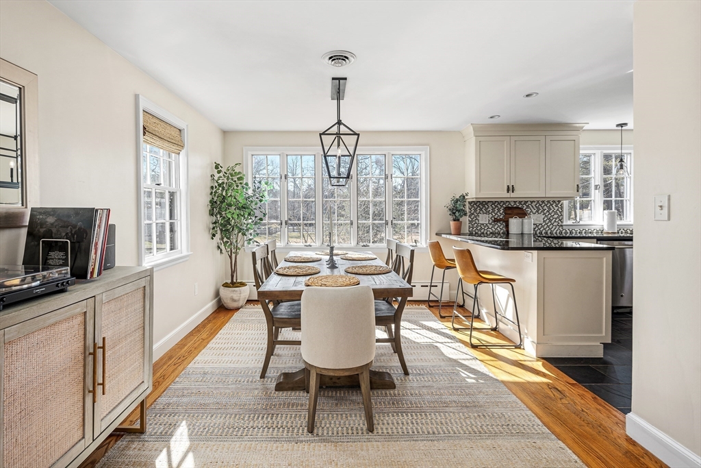 36 Howland Lane Hingham, MA 02043 - Photo 6 of 33 a dining room with furniture a chandelier and wooden floor