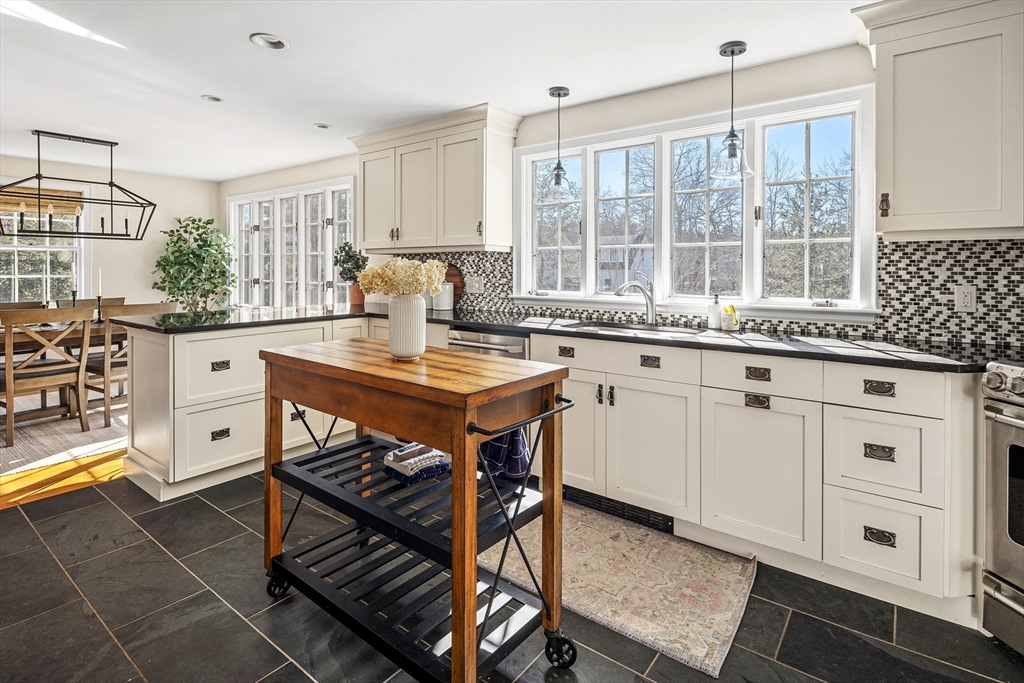 36 Howland Lane Hingham, MA 02043 - Photo 10 of 33 a kitchen with a stove a sink and cabinets