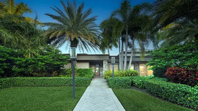 a kitchen with kitchen island a table and chairs in it