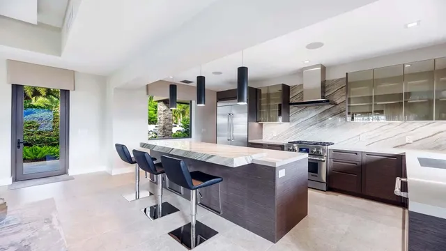 a kitchen with a stove and a refrigerator