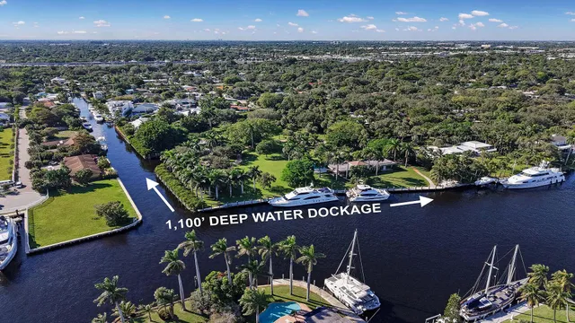 a view of a swimming pool with a patio and a yard