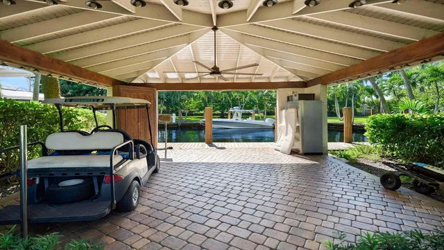 a house view with swimming pool and green space