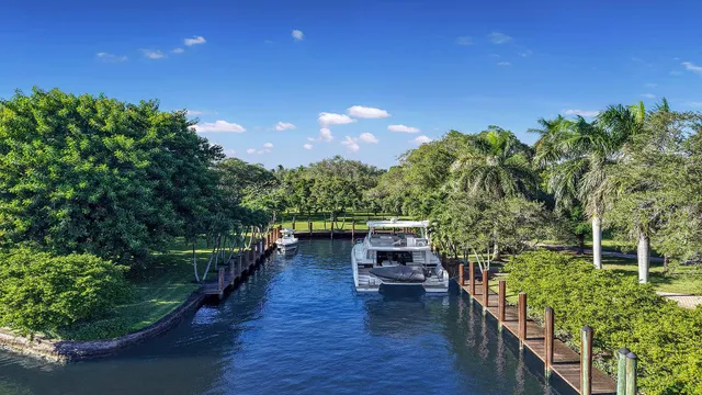a view of a house with a yard patio and a garden