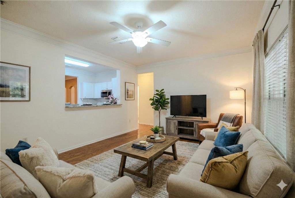 a living room with furniture and a flat screen tv