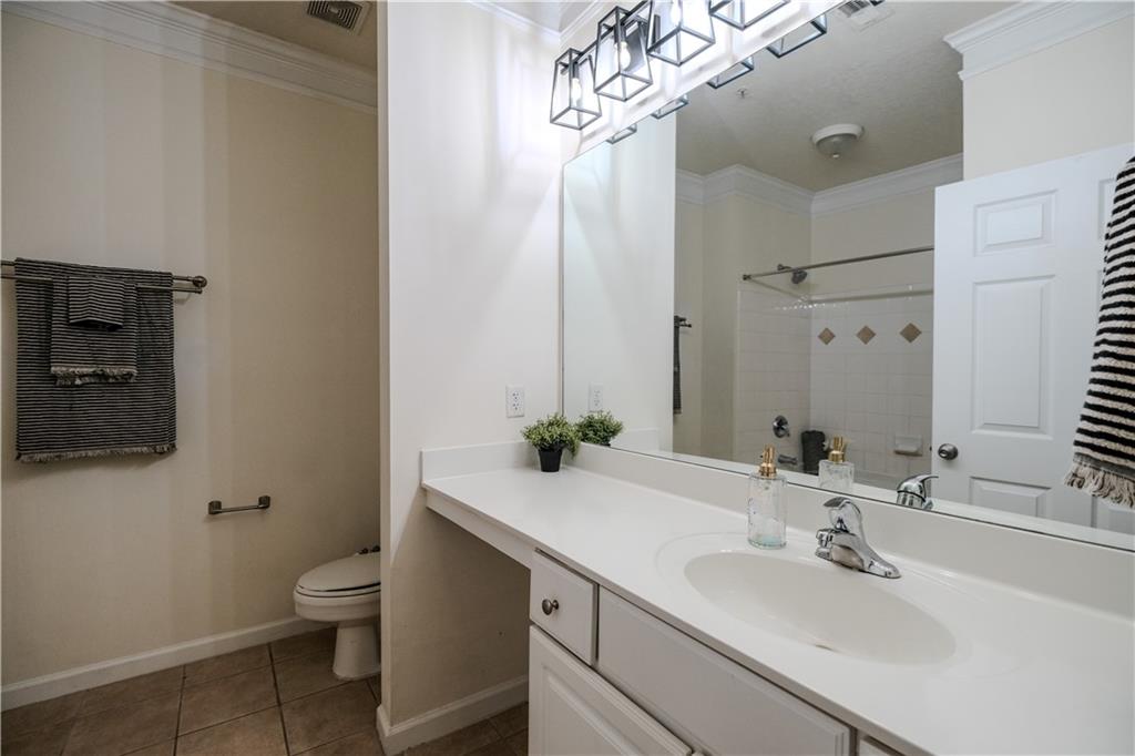 4007 Westchester Ridge Northeast Atlanta, GA 30329 - Photo 12 of 35 a bathroom with a sink a toilet and mirror