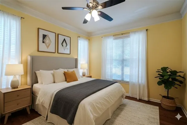 a bedroom with a bed and a potted plant