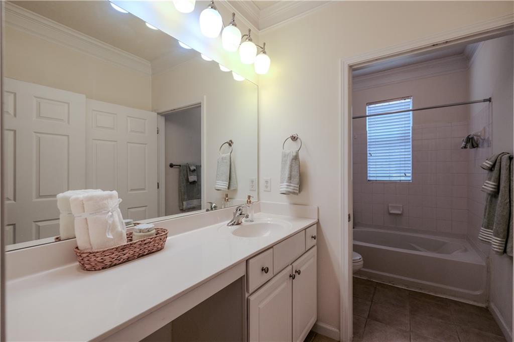 4007 Westchester Ridge Northeast Atlanta, GA 30329 - Photo 17 of 35 a bathroom with a sink a toilet and shower