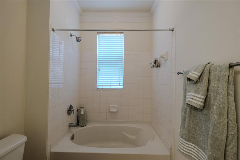 4007 Westchester Ridge Northeast Atlanta, GA 30329 - Photo 18 of 35 a bathroom with a tub and shower