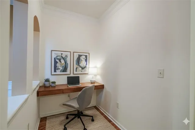 a workspace with furniture and painting on the wall