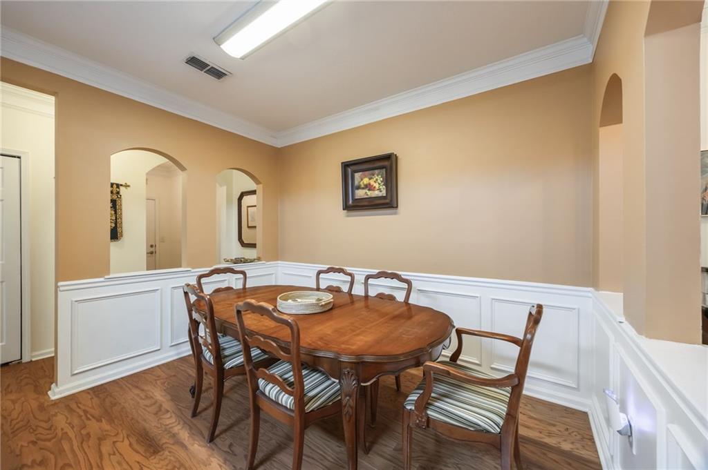 4007 Westchester Ridge Northeast Atlanta, GA 30329 - Photo 22 of 35 a view of a dining room with furniture and wooden floor