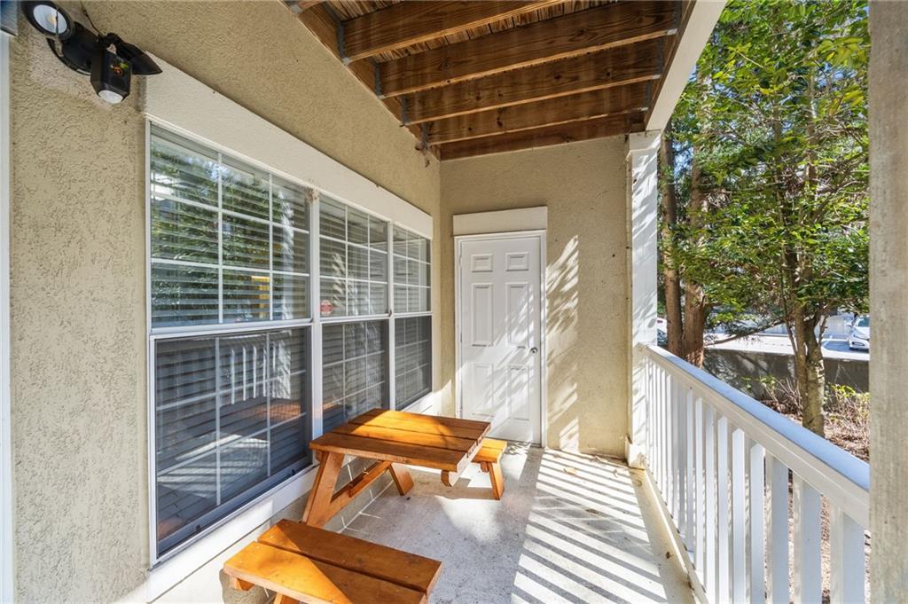 4007 Westchester Ridge Northeast Atlanta, GA 30329 - Photo 24 of 35 a balcony with furniture and wooden floor