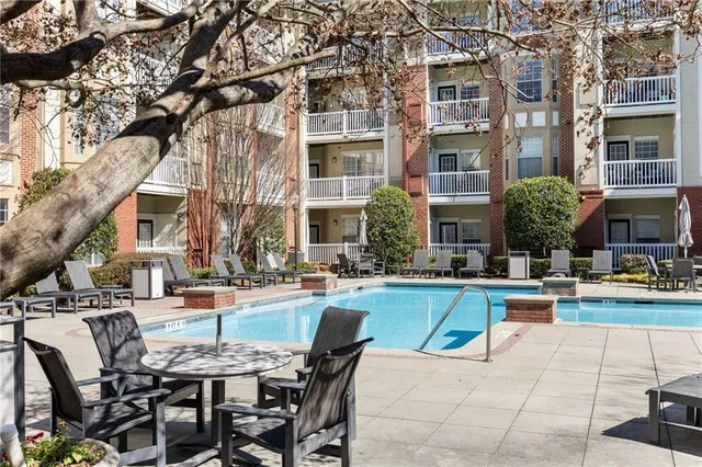 a view of a house with trees in the background