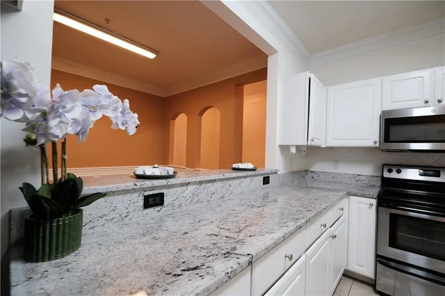 a kitchen that has a sink and a stove