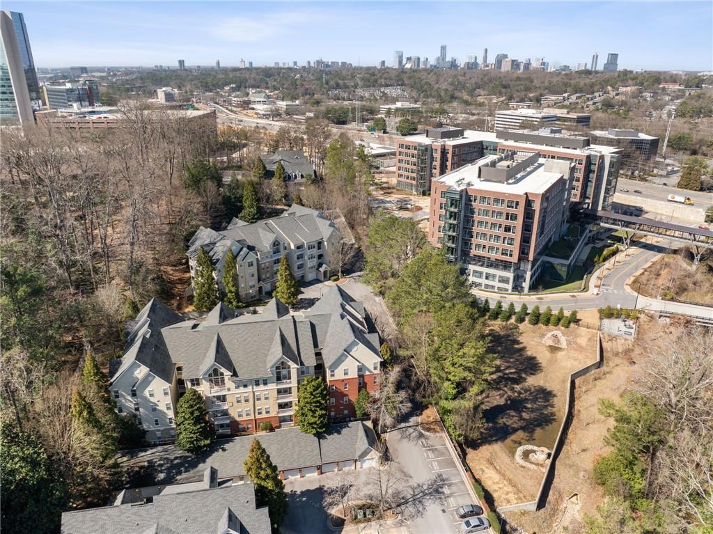 4007 Westchester Ridge Northeast Atlanta, GA 30329 - Photo 34 of 35 an aerial view of a house with a yard and lake view