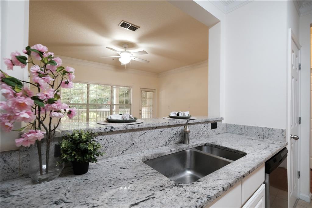 4007 Westchester Ridge Northeast Atlanta, GA 30329 - Photo 6 of 35 a kitchen with a sink and chandelier